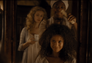 Mabel, a servant, helps Dido brush her hair properly