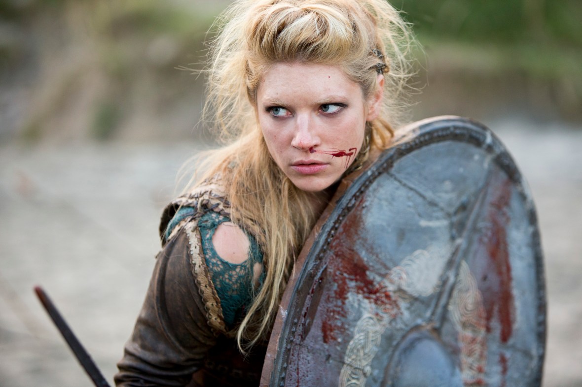 Lagertha holding a circle shield with blood coming from her nose