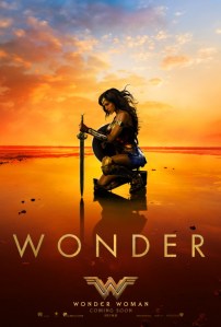 Poster of Wonder Woman kneeling on a beach with a sword and shield